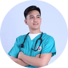 Vincent, a licensed Philippine physical therapist and the founder of AlliedWell, in clinical scrubs.