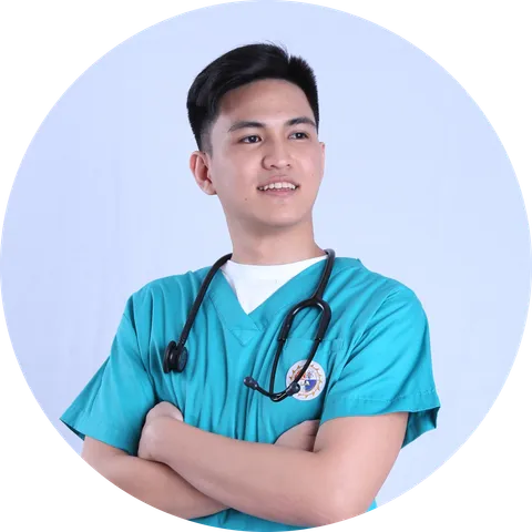 Vincent, a licensed Philippine physical therapist and the founder of AlliedWell, in clinical scrubs.